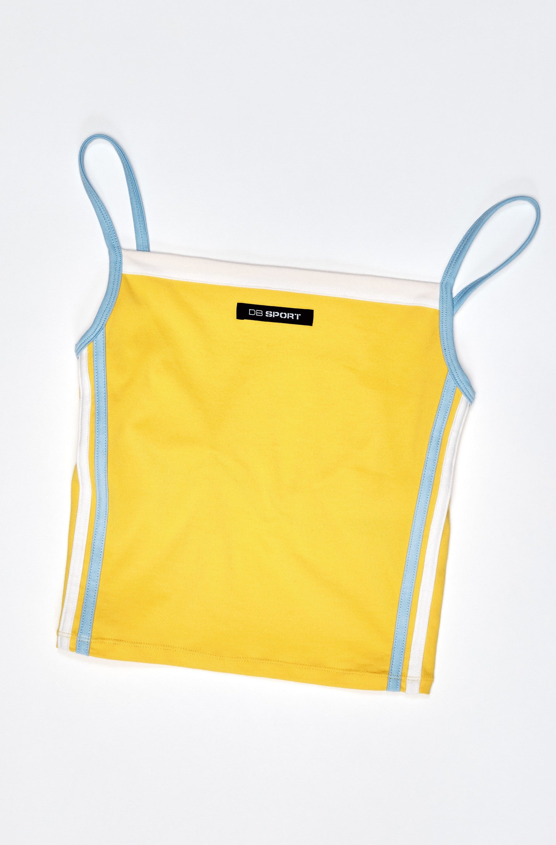 Yellow tank top with thin straps on a light gray background