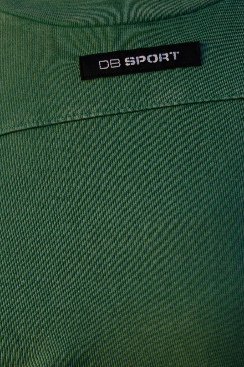 Green sweatshirt with a 'DB Sport' label on a green background