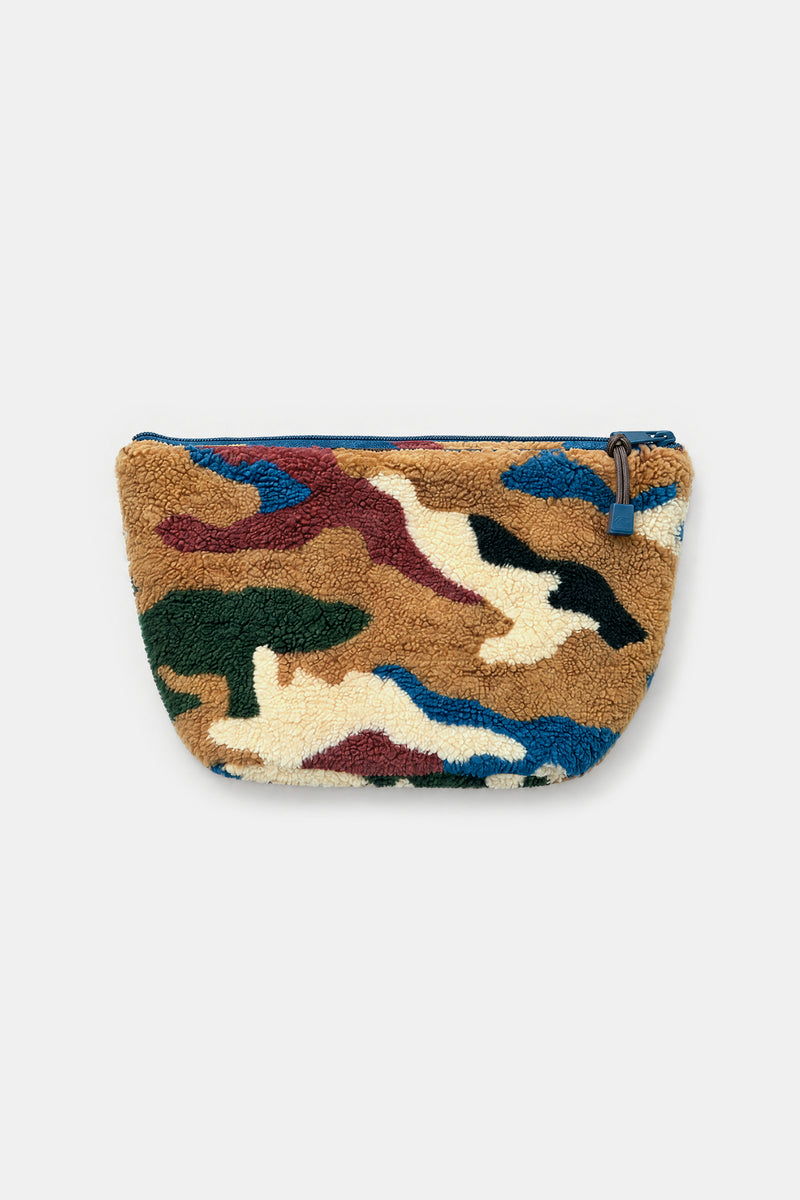 A small zippered pouch with a plush, textured fabric surface featuring a multicolor camouflage pattern in brown, beige, blue, green, and burgundy, shown against a plain light gray background.