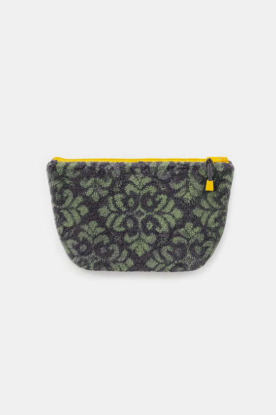 A small zippered pouch with a textured green and black damask pattern, featuring a bright yellow zipper and pull tab, shown against a plain light gray background.