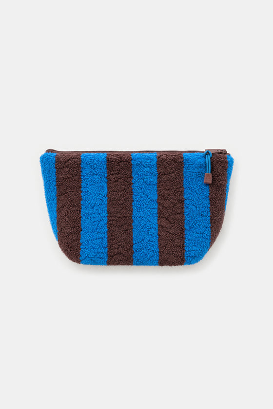 A small zip pouch with vertical blue and brown stripes, made from a textured sherpa fabric, shown against a light gray background.