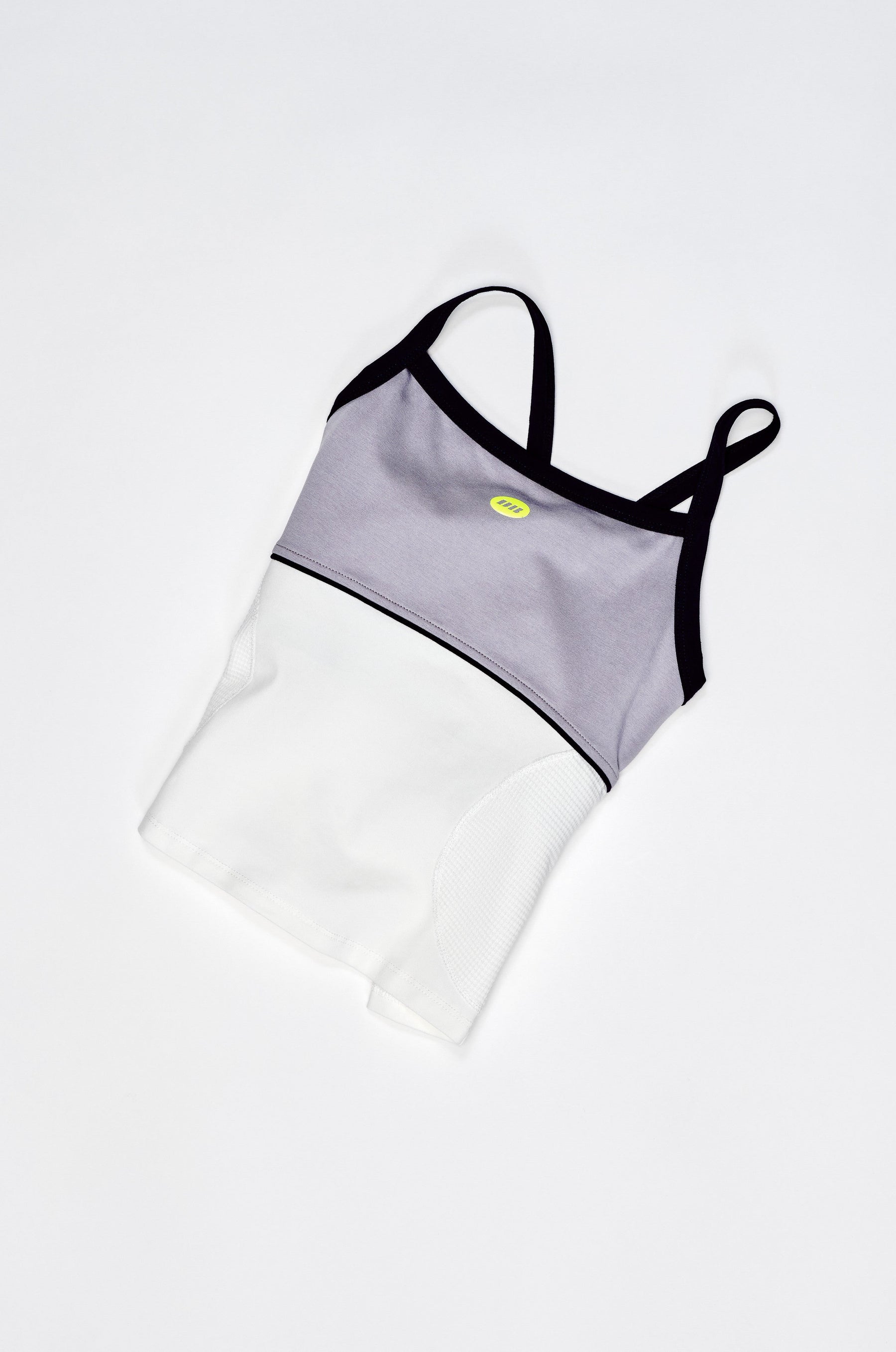 Two-piece swimsuit with gray top and white bottom on a light gray background
