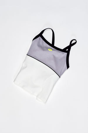 Two-piece swimsuit with gray top and white bottom on a light gray background