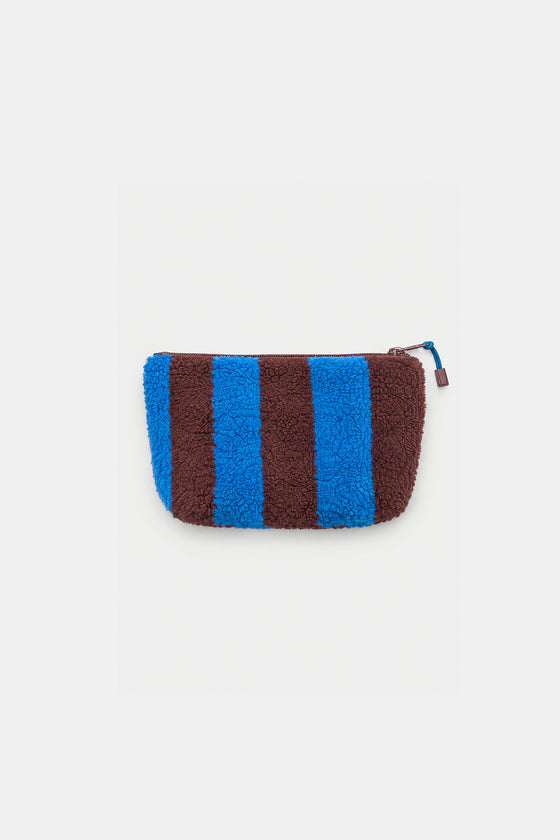 A small zippered pouch with a fuzzy teddy texture, featuring alternating vertical stripes of bright blue and dark brown, on a light gray background.
