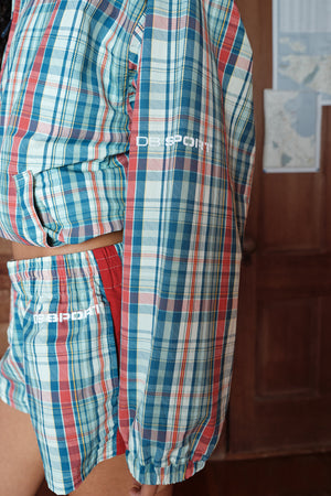 Plaid shirt and shorts with 'DB sport' branding on a plain background
|M1