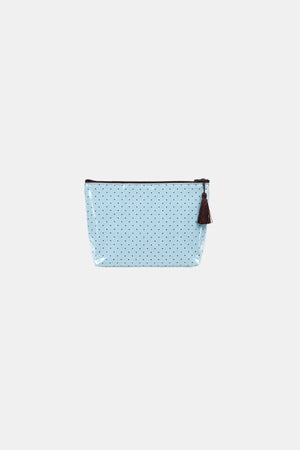 Light blue glossy makeup pouch with small dark brown polka dots, a brown zip top and a brown tassel pull, front flat view.