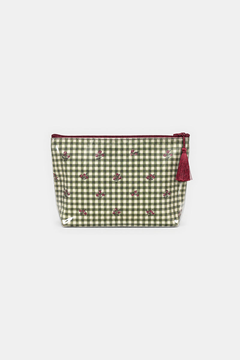 Flat front view of a makeup bag with a green and cream gingham pattern, small red berry motifs, a red zip and a red tassel.