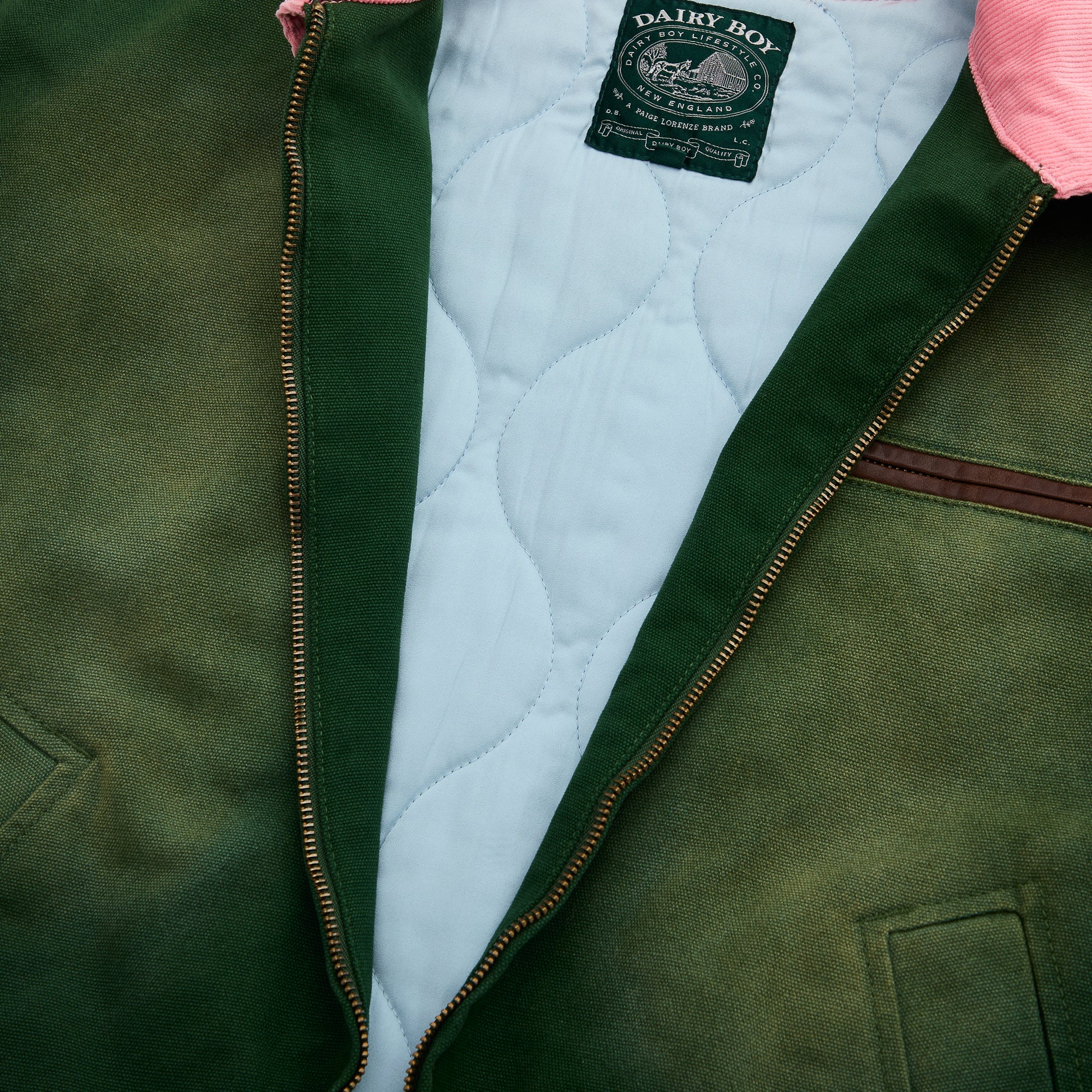 Green jacket with quilted lining and visible brand label