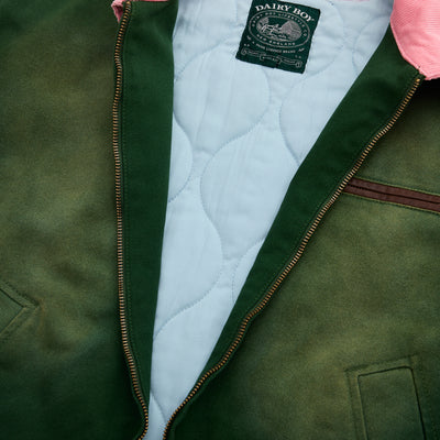 Green jacket with quilted lining and visible brand label