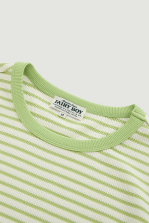 Close-up of a green and white striped shirt with a 'Dairy Boy' label on a light gray background.