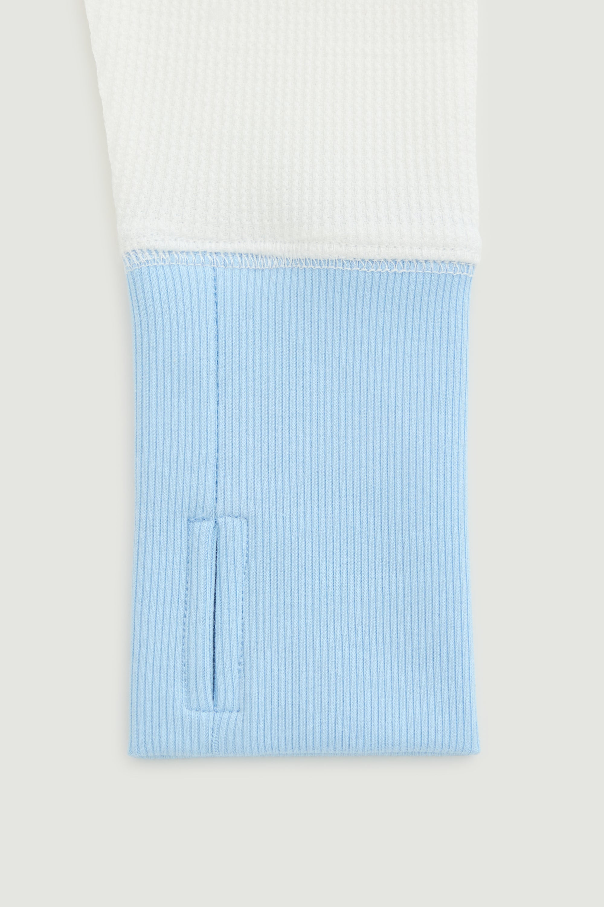 Light blue textured pocket on a white background