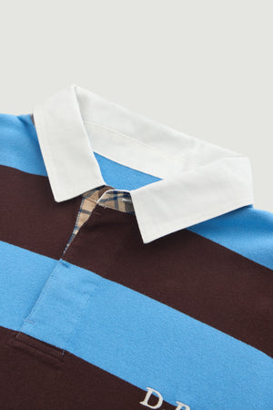 Close-up of a shirt with a checkered pattern and blue and brown stripes on a white background
