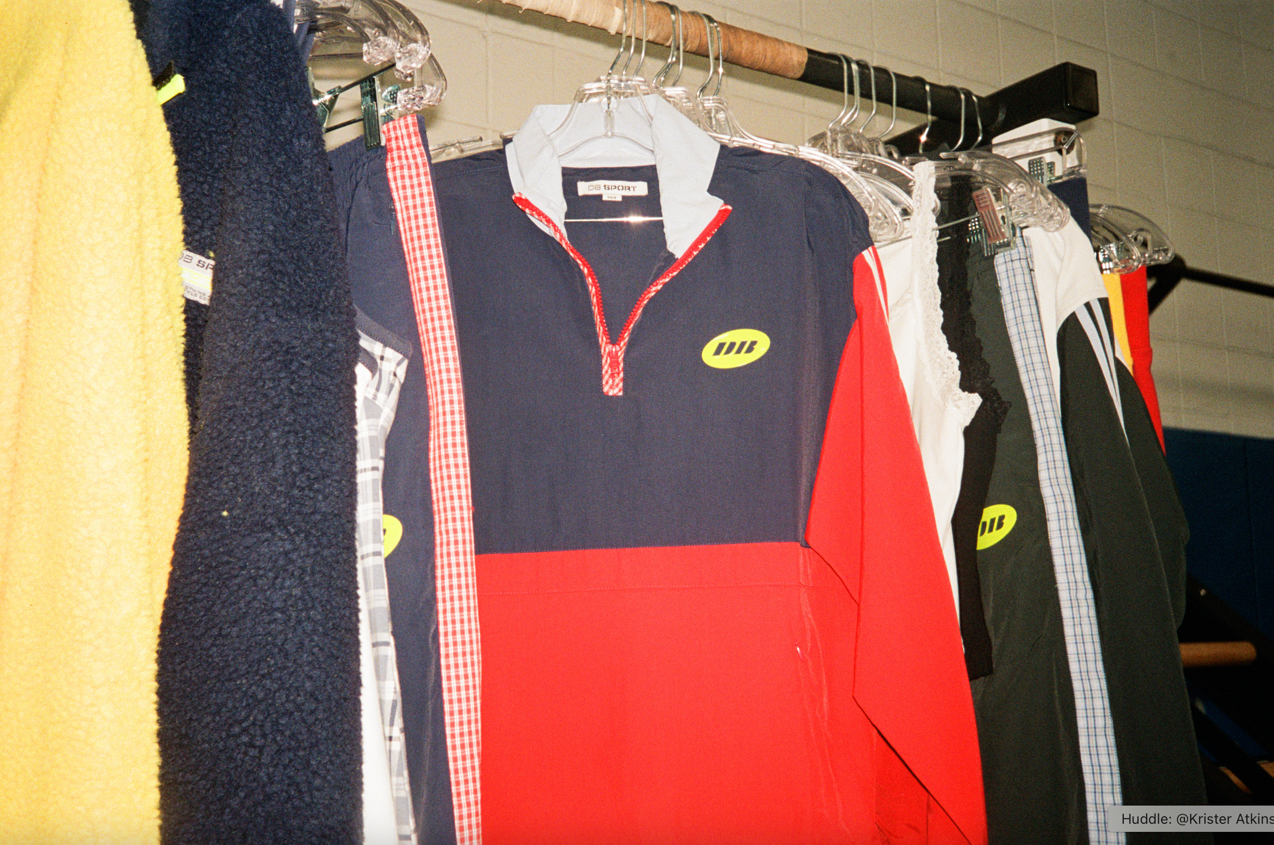 Collection of jackets with visible brand logos on hangers