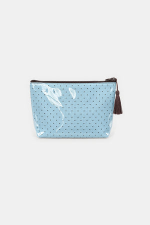Flat front view of a light blue makeup pouch with small dark dots, a brown top zip and a brown tassel pull, under clear glossy cover.